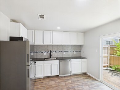 Kitchen with appliances with stainless steel finis
