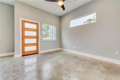 Foyer entrance featuring finished concrete floors