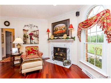 Formal Family Room, Key Features- Marble Fireplace, Crown Molding, Wood Flooring