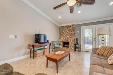Stone fireplace and crown molding.