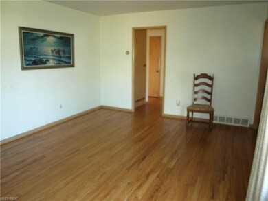 Lovely hardwood floors and spacious living room.
