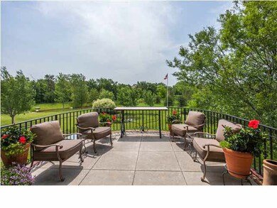 CURVED STONE WALL PATIO OVERLOOKING FISHING POND A