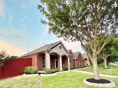 View of front of property with brick siding and a porch