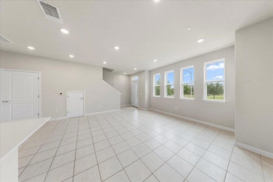 Empty room with recessed lighting, baseboards, an