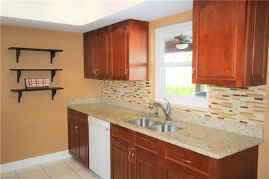 Cozy Kitchen with Granite & Custom Backsplash