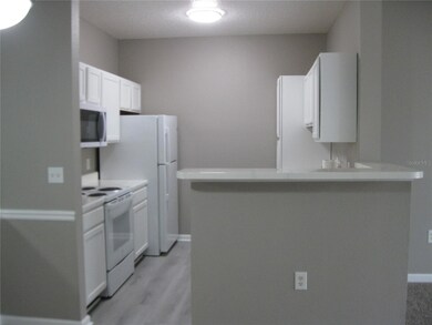 KITCHEN SHOWING BREAKFAST BAR TO DR