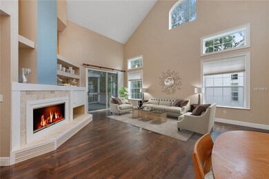 LIVING ROOM with SLIDING DOORS leading to the SCRE