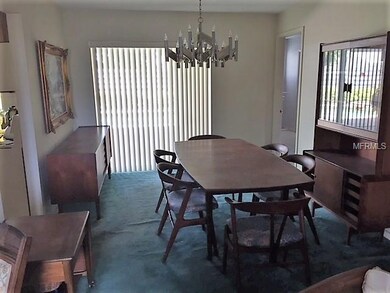 Dining Room opens up to the back porch and pool