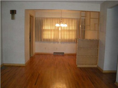 8x9 Dining Room with original hardwood floors