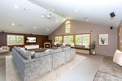 Brightly lit fabulous family room with cathedral c