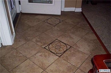 tiled entryway and thru kitchen