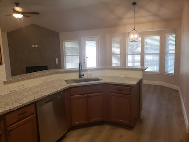 Kitchen featuring stainless steel dishwasher, a s