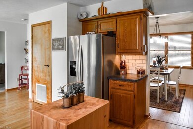 The kitchen has under cabinet lighting and a pantry.