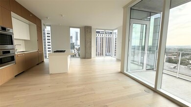 Kitchen featuring floor to ceiling windows, plent