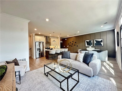 Living room with open concept views *Photos are from same floor plan but different home site*