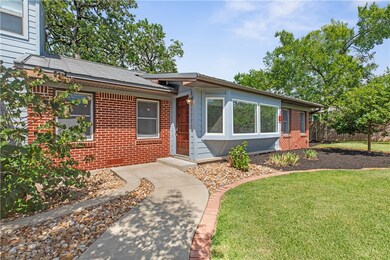 Red brick exterior with Hardi plank siding