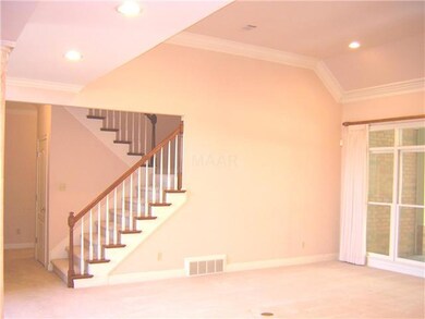 The stairs leading to the 2nd floor are located on