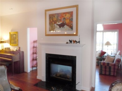 View of double sided fireplace from great room