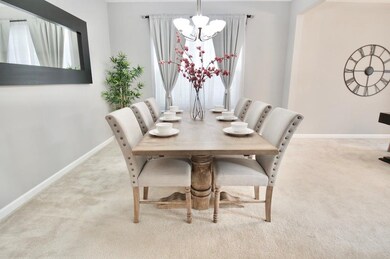 Dining area is spacious for family gatherings or entertaining.