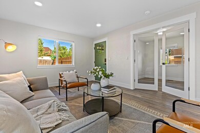 Living room featuring wood finished floors, plenty of natural light, and recessed lighting