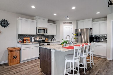 Kitchen featuring appliances with stainless steel
