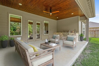 Stunning covered back patio with a built-in kitche