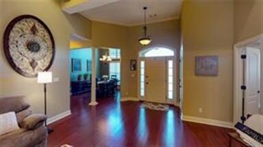 A welcoming floor plan with beautiful hardwood flo