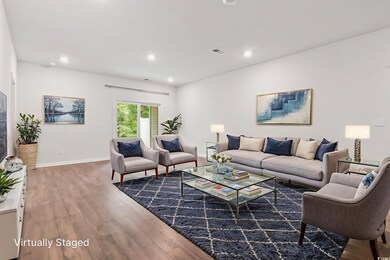 Living room featuring wood finished floors and recessed lighting