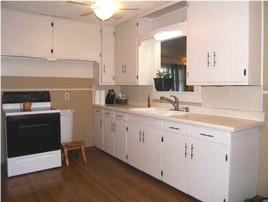 The west and south walls of the kitchen with the o