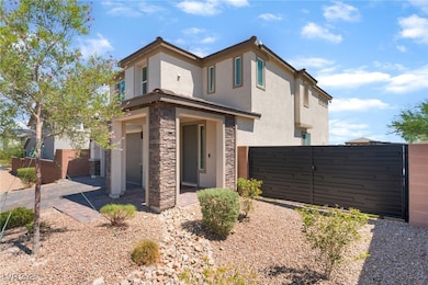 View of front of house with stucco siding and ston
