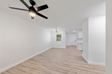 Unfurnished living room featuring light hardwood /