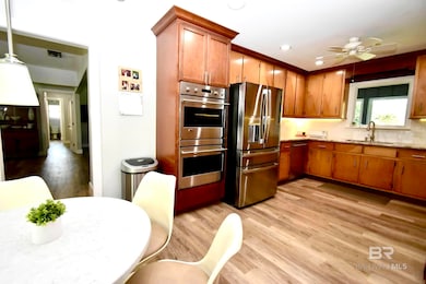 Kitchen featuring light hardwood / wood-style flooring, and stainless steel appliances