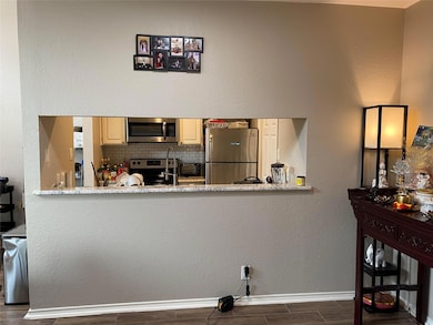 Kitchen featuring appliances with stainless steel 