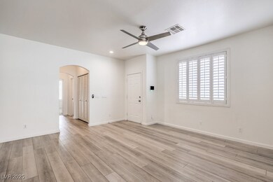 Living room featuring light wood-style floors, bas