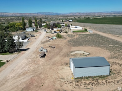 Overview of rural landscape featuring a mountainous background