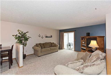 Living room with newer sliding glass door to backy