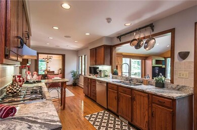 The kitchen has been nicely updated with granite c