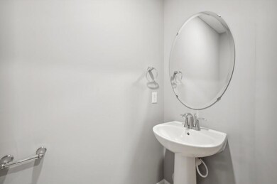 Conveniently located main level powder bath easily accessible from the entryway.