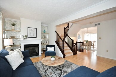 Cozy gas burning fireplace with built-in shelving