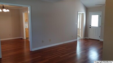 Living room with fresh paint! Beautiful engineered hardwoods!