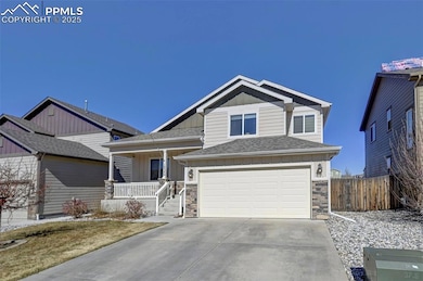 View of front facade with driveway, an attached ga