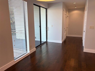 Corridor with baseboards and dark wood finished f