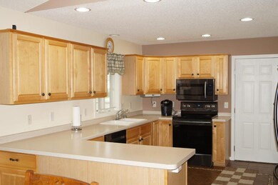 Kitchen with maple cabinets