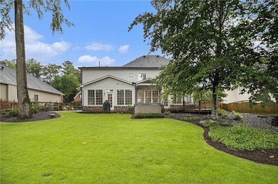 Rear view of property featuring a deck