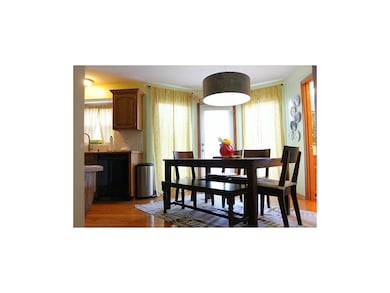 Hardwoods in dining room with walkout to deck