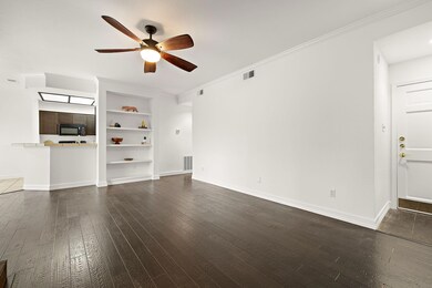 Unfurnished living room with visible vents, baseb