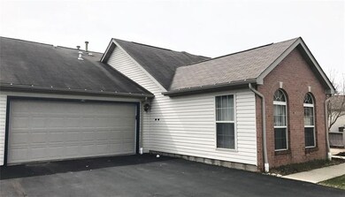 Two car attached garage with key pad a remote opener.