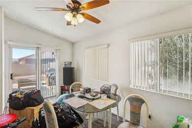 Dining room featuring ceiling fan, carpet flooring