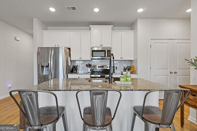 white cabinets and gorgoeous granite tops really make this kitchen pop.