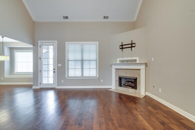 Unfurnished living room featuring a premium firepl